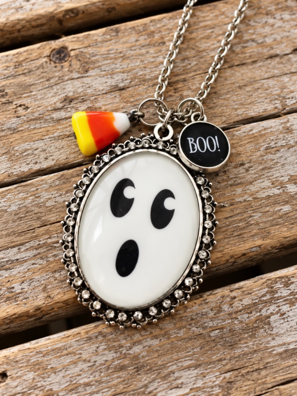 Kole Jax ghost necklace with Halloween charms on silver chain.